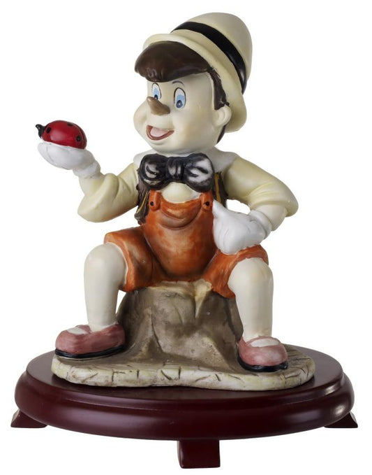Figura de Pinocho de cerámica sobre base de madera de cerezo 9D7383