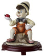Figura de Pinocho de cerámica sobre base de madera de cerezo 9D7383